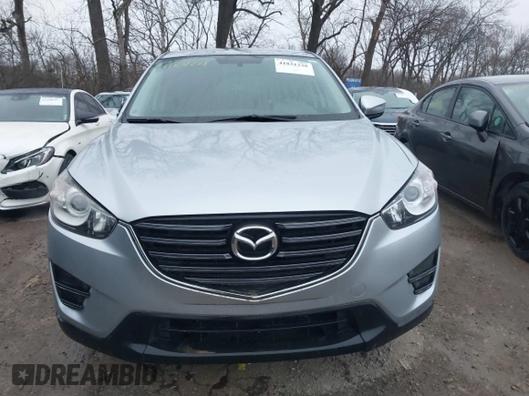 2016 Mazda CX-5 Sport with VIN JM3KE2BY5G0647715, listed as a IAAI auction lot 41831228 with 89,689 mi miles and . Bid and sale history available at DreamBid. Image 12.