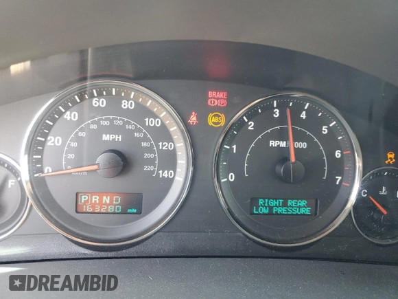 2005 Jeep Grand Cherokee Limited with VIN 1J8HR58265C699077, listed as a Copart auction lot 58490185 with 163,280 mi miles and Salvage title. Bid and sale history available at DreamBid. Image 9.
