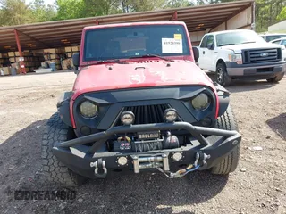 2007 Jeep Wrangler Unlimited X with VIN 1J4GB39197L150245, listed as a IAAI auction lot 41920390 with 239,532 mi miles and . Bid and sale history available at DreamBid. Image 12.