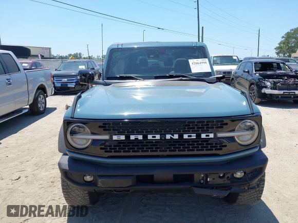 2021 Ford Bronco z VIN 1FMDE5CP5MLA98340, wystawiony jako IAAI lot #42064998 z przebiegiem 38 569 mil mil oraz . Historia ofert i sprzedaży dostępna na DreamBid. Obrazek 13.