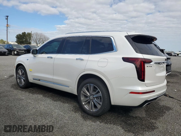 2021 Cadillac XT6 Premium Luxury z VIN 1GYKPCRSXMZ230618, wystawiony jako Copart lot #81022824 z przebiegiem Nie podano mil oraz Szkoda całkowita • Salvage title. Historia ofert i sprzedaży dostępna na DreamBid. Obrazek 2.