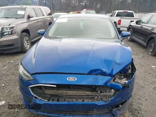 2017 Ford Fusion SE z VIN 3FA6P0H77HR309263, wystawiony jako IAAI lot #41914769 z przebiegiem 136 833 mil mil oraz . Historia ofert i sprzedaży dostępna na DreamBid. Obrazek 11.