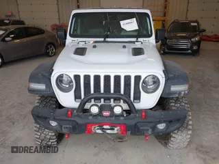 2022 Jeep Wrangler Unlimited Rubicon with VIN 1C4JJXFM0NW154202, listed as a IAAI auction lot 42400067 with 60,486 mi miles and . Bid and sale history available at DreamBid. Image 6.