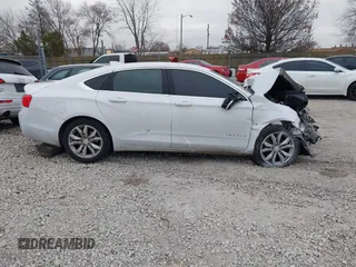 2018 Chevrolet Impala LT z VIN 1G1105S36JU133129, wystawiony jako IAAI lot #41078651 z przebiegiem 100 986 mil mil oraz . Historia ofert i sprzedaży dostępna na DreamBid. Obrazek 12.