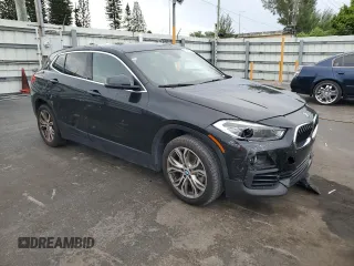 2018 BMW X2 sDrive28i with VIN WBXYJ3C34JEJ91176, listed as a Copart auction lot 63418365 with 62,586 mi miles and Salvage title. Bid and sale history available at DreamBid. Image 4.