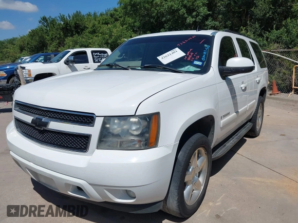 2007 Chevrolet Tahoe LS with VIN 1GNFC13007R310861, listed as a IAAI auction lot 42621401 with 241,291 mi miles and . Bid and sale history available at DreamBid. Image 2.