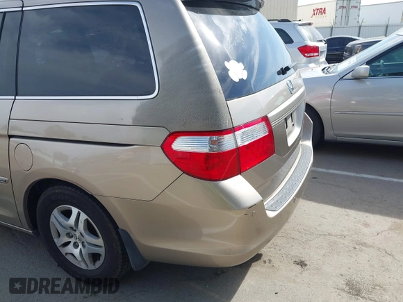 2005 Honda Odyssey EX-L z VIN 5FNRL38615B407908, wystawiony jako IAAI lot #42076045 z przebiegiem 170 950 mil mil oraz . Historia ofert i sprzedaży dostępna na DreamBid. Obrazek 15.
