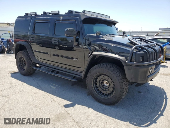 2005 Hummer H2 SUV z VIN 5GRGN23U05H117630, wystawiony jako Copart lot #57087305 z przebiegiem 60 260 mil mil oraz Szkoda całkowita • Salvage title. Historia ofert i sprzedaży dostępna na DreamBid. Obrazek 4.