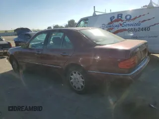 1998 Mercedes-Benz E 320 with VIN WDBJF25FXWA549962, listed as a Copart auction lot 87876005 with 303,884 mi miles and Salvage Title. Bid and sale history available at DreamBid. Image 2.