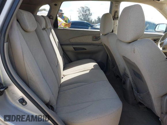 2005 Hyundai Tucson GL with VIN KM8JM12B95U097899, listed as a IAAI auction lot 41953290 with 111,090 mi miles. Bid and sale history available at carsss.com. Image 8.