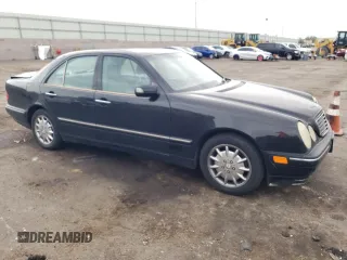 2000 Mercedes-Benz E-Class with VIN WDBJF65J5YB068297, listed as a Copart auction lot 69199004 with 236,751 mi miles and Salvage Title. Bid and sale history available at carsss.com. Image 4.