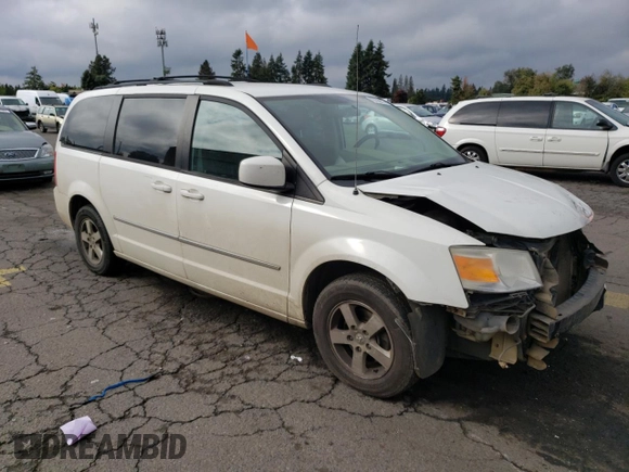 2010 Dodge Grand Caravan SXT with VIN 2D4RN5D11AR331804, listed as a Copart auction lot 73735873 with 183,923 mi miles and Salvage Title. Bid and sale history available at DreamBid. Image 4.