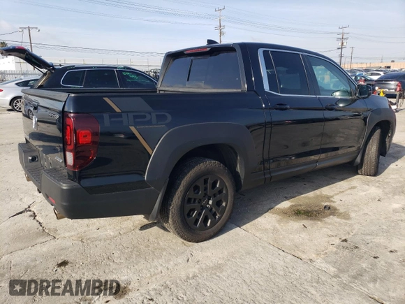 2023 Honda Ridgeline RTL with VIN 5FPYK3F52PB023574, listed as a Copart auction lot 44419565 with 15,205 mi miles and Salvage title. Bid and sale history available at DreamBid. Image 3.
