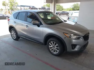2014 Mazda CX-5 Touring with VIN JM3KE2CY0E0383041, listed as a IAAI auction lot 42345378 with 114,058 mi miles and . Bid and sale history available at DreamBid. Image 1.