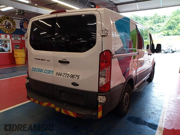 2016 Ford Transit Cargo z VIN 1FTYE1YM3GKB15532, wystawiony jako IAAI lot #42788480 z przebiegiem 64 600 mil mil oraz . Historia ofert i sprzedaży dostępna na DreamBid. Obrazek 2.