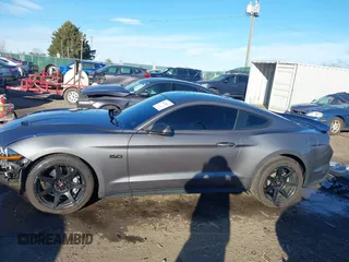 2021 Ford Mustang GT z VIN 1FA6P8CF9M5117126, wystawiony jako IAAI lot #41647619 z przebiegiem 31 076 mil mil oraz . Historia ofert i sprzedaży dostępna na DreamBid. Obrazek 15.