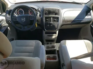 2014 Dodge Grand Caravan American Value with VIN 2C4RDGBG3ER323793, listed as a Copart auction lot 49095945 with 102,129 mi miles and Salvage Title. Bid and sale history available at DreamBid. Image 8.