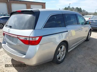 2012 Honda Odyssey Touring with VIN 5FNRL5H92CB108690, listed as a IAAI auction lot 41826580 with 150,327 mi miles and . Bid and sale history available at DreamBid. Image 4.