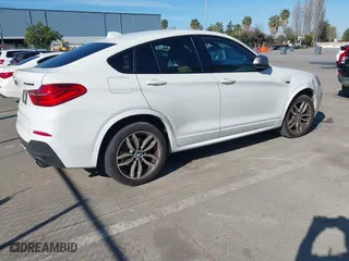 2017 BMW X4 M40i with VIN 5UXXW7C59H0U25191, listed as a IAAI auction lot 41867852 with 76,301 mi miles. Bid and sale history available at carsss.com. Image 4.
