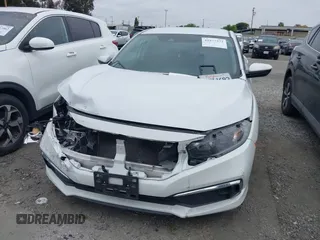 2020 Honda Civic LX with VIN 2HGFC2F64LH593100, listed as a IAAI auction lot 41877572 with 76,713 mi miles and . Bid and sale history available at DreamBid. Image 12.