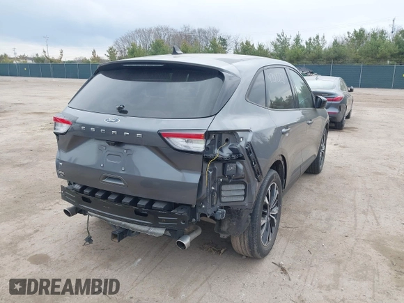 2021 Ford Escape SE z VIN 1FMCU0G62MUA94307, wystawiony jako IAAI lot #42018728 z przebiegiem 142 662 mil mil oraz . Historia ofert i sprzedaży dostępna na DreamBid. Obrazek 6.