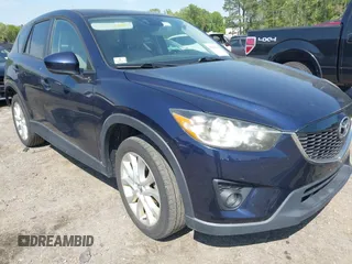 2014 Mazda CX-5 Grand Touring with VIN JM3KE4DYXE0342720, listed as a IAAI auction lot 42026388 with 114,072 mi miles and . Bid and sale history available at carsss.com. Image 1.