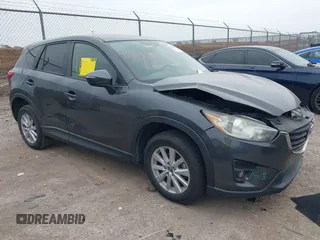 2016 Mazda CX-5 Touring z VIN JM3KE2CY9G0783988, wystawiony jako IAAI lot #41480690 z przebiegiem 111 963 mil mil oraz . Historia ofert i sprzedaży dostępna na DreamBid. Obrazek 1.