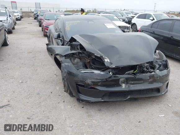 2022 Tesla Model S Plaid with VIN 5YJSA1E65NF484149, listed as a IAAI auction lot 40937538 with 11,459 mi miles and . Bid and sale history available at DreamBid. Image 1.