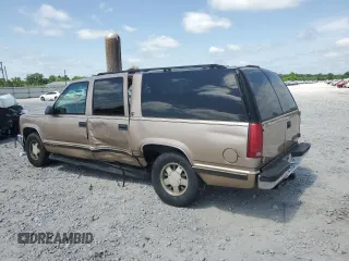 1999 Chevrolet Suburban with VIN 3GNEC16R6XG205408, listed as a Copart auction lot 57169415 with 303,412 mi miles and Salvage title. Bid and sale history available at DreamBid. Image 2.