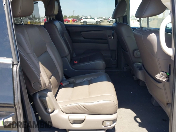 2014 Honda Odyssey Touring with VIN 5FNRL5H99EB133864, listed as a IAAI auction lot 42201359 with 122,490 mi miles and . Bid and sale history available at DreamBid. Image 8.