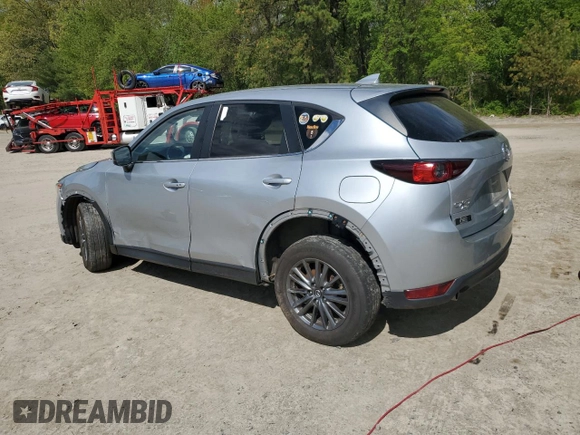 2021 Mazda CX-5 Touring z VIN JM3KFBCM1M0343804, wystawiony jako Copart lot #56194795 z przebiegiem 100 039 mil mil oraz Tytuł czysty. Historia ofert i sprzedaży dostępna na DreamBid. Obrazek 2.