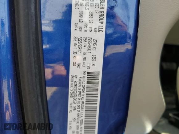 2013 Dodge Grand Caravan Crew with VIN 2C4RDGDG2DR654554, listed as a Copart auction lot 53391705 with 131,312 mi miles and Clean Title. Bid and sale history available at DreamBid. Image 13.