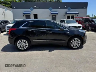 2018 Cadillac XT5 Premium Luxury FWD z VIN 1GYKNERS6JZ139813, wystawiony jako Copart lot #57681285 z przebiegiem 96 567 mil mil oraz Nie do naprawy. Historia ofert i sprzedaży dostępna na DreamBid. Obrazek 13.