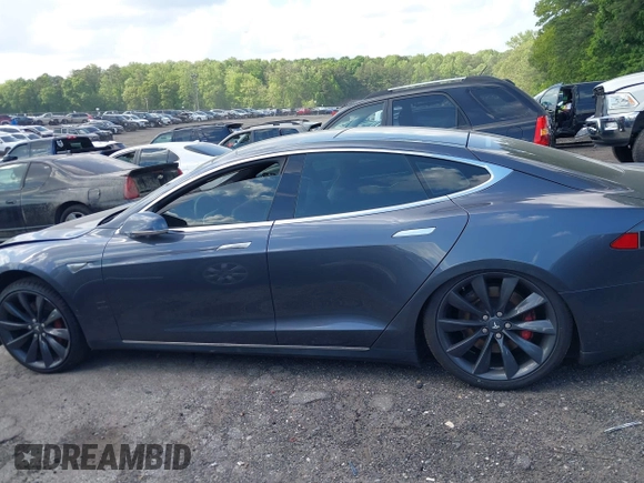 2014 Tesla Model S P85D with VIN 5YJSA1H29EFP63032, listed as a IAAI auction lot 42132145 with Not Provided miles and . Bid and sale history available at DreamBid. Image 13.