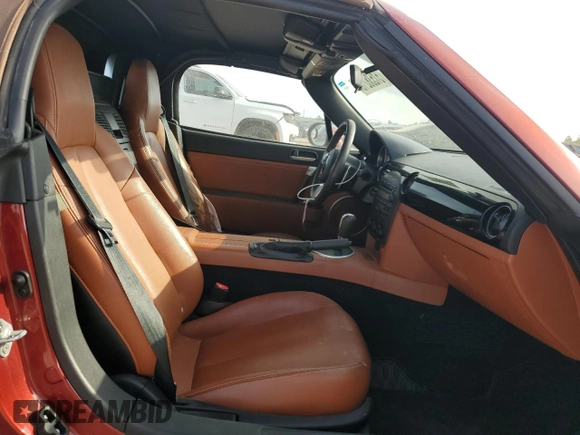 2007 Mazda MX-5 Miata Sport z VIN JM1NC25F270127574, wystawiony jako Copart lot #51538215 z przebiegiem 131 339 mil mil oraz Szkoda całkowita • Salvage title. Historia ofert i sprzedaży dostępna na DreamBid. Obrazek 10.