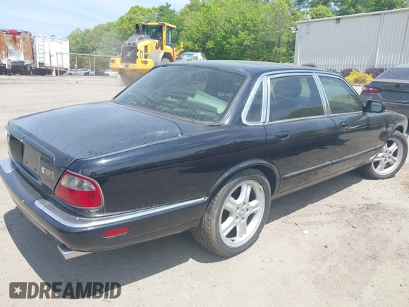 1999 Jaguar XJ with VIN SAJPX1841XC864072, listed as a IAAI auction lot 42176220 with 122,712 mi miles and . Bid and sale history available at DreamBid. Image 4.