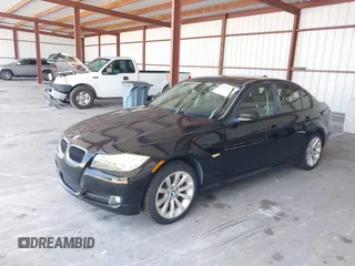 2011 BMW 3 Series 328i with VIN WBAPH7G54BNN07293, listed as a IAAI auction lot 42113254 with 128,118 mi miles. Bid and sale history available at carsss.com. Image 2.