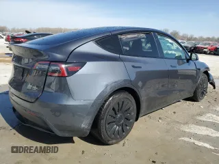2023 Tesla Model Y Long Range z VIN 7SAYGDEE7PF822934, wystawiony jako Copart lot #49285285 z przebiegiem Nie podano mil oraz Szkoda całkowita • Salvage title. Historia ofert i sprzedaży dostępna na DreamBid. Obrazek 3.
