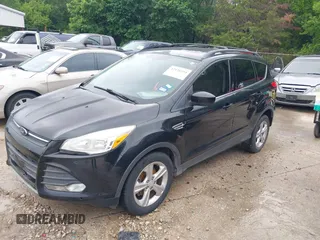 2013 Ford Escape SE with VIN 1FMCU0GX5DUB68604, listed as a IAAI auction lot 42126594 with 165,540 mi miles and . Bid and sale history available at carsss.com. Image 2.