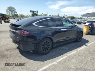 2017 Tesla Model X 90D with VIN 5YJXCBE20HF051099, listed as a Copart auction lot 52208205 with 118,828 mi miles and Salvage Title. Bid and sale history available at DreamBid. Image 3.