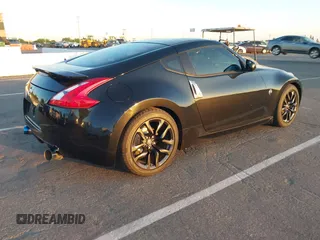 2015 Nissan 370Z Sport z VIN JN1AZ4EH5FM442339, wystawiony jako IAAI lot #42304030 z przebiegiem 73 272 mil mil oraz . Historia ofert i sprzedaży dostępna na DreamBid. Obrazek 4.