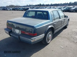 1986 Cadillac Seville z VIN 1G6KS6989GU813079, wystawiony jako IAAI lot #41732353 z przebiegiem Nie podano mil oraz . Historia ofert i sprzedaży dostępna na DreamBid. Obrazek 4.