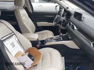2023 Mazda CX-5 S Premium with VIN JM3KFBDM4P0185865, listed as a IAAI auction lot 42040234 with 32,761 mi miles and . Bid and sale history available at DreamBid. Image 5.