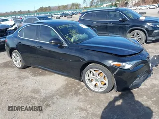 2021 Alfa Romeo Giulia Ti z VIN ZARFANBN1M7649953, wystawiony jako IAAI lot #41591153 z przebiegiem 16 672 mil mil oraz . Historia ofert i sprzedaży dostępna na DreamBid. Obrazek 1.