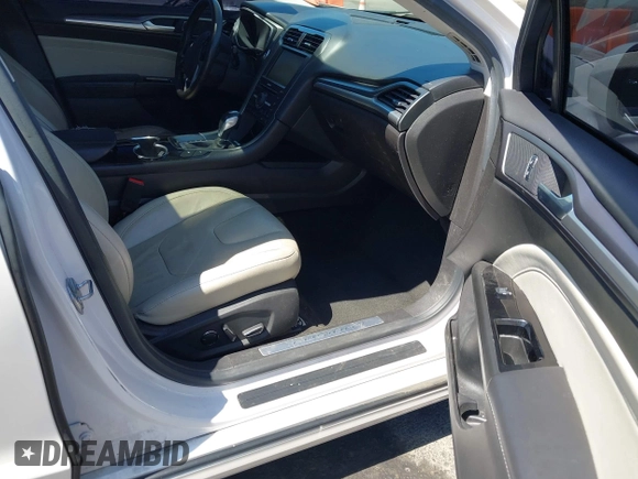2016 Ford Fusion Titanium z VIN 3FA6P0SU2GR357508, wystawiony jako IAAI lot #42551834 z przebiegiem 177 425 mil mil oraz . Historia ofert i sprzedaży dostępna na DreamBid. Obrazek 5.