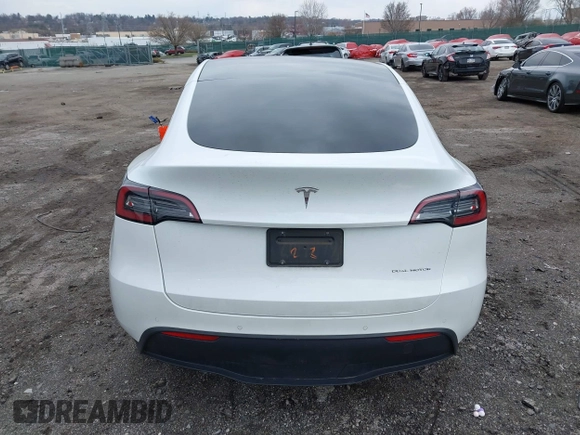 2022 Tesla Model Y Long Range with VIN 7SAYGAEE4NF516625, listed as a IAAI auction lot 41892225 with 33,054 mi miles and . Bid and sale history available at DreamBid. Image 16.