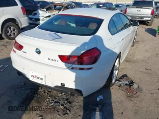 2015 BMW 6 Series 640i xDrive with VIN WBA6B8C50FD453317, listed as a IAAI auction lot 41635430 with 77,811 mi miles and . Bid and sale history available at DreamBid. Image 4.