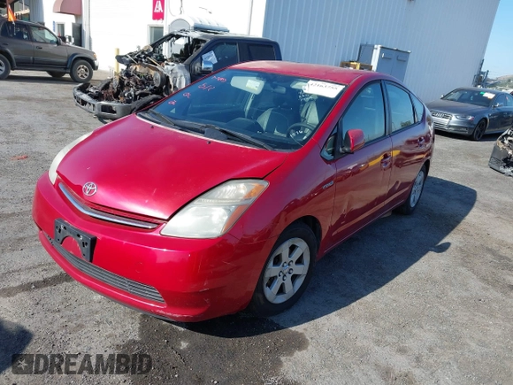 2007 Toyota Prius z VIN JTDKB20U977661576, wystawiony jako IAAI lot #42163755 z przebiegiem 142 012 mil mil oraz . Historia ofert i sprzedaży dostępna na DreamBid. Obrazek 2.
