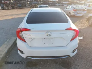 2019 Honda Civic LX with VIN 19XFC2F61KE014007, listed as a IAAI auction lot 41795070 with 64,259 mi miles and . Bid and sale history available at DreamBid. Image 16.
