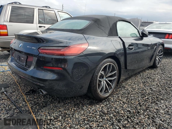 2022 BMW Z4 sDrive30i with VIN WBAHF3C04NWX42062, listed as a Copart auction lot 74989854 with 0 mi miles and Salvage Title. Bid and sale history available at carsss.com. Image 3.